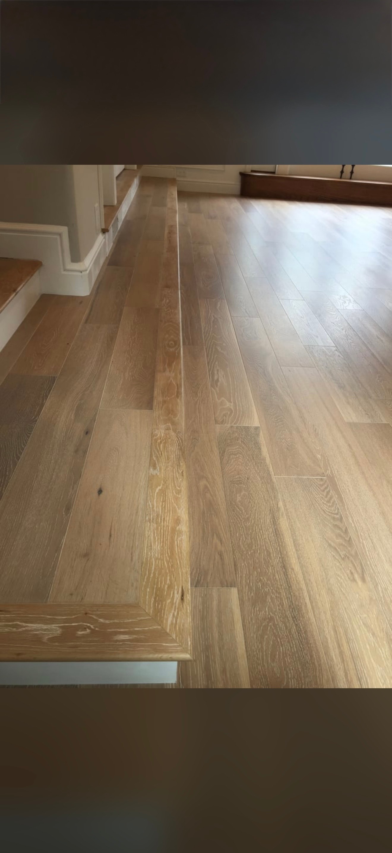 Wide plank hardwood flooring in empty room
