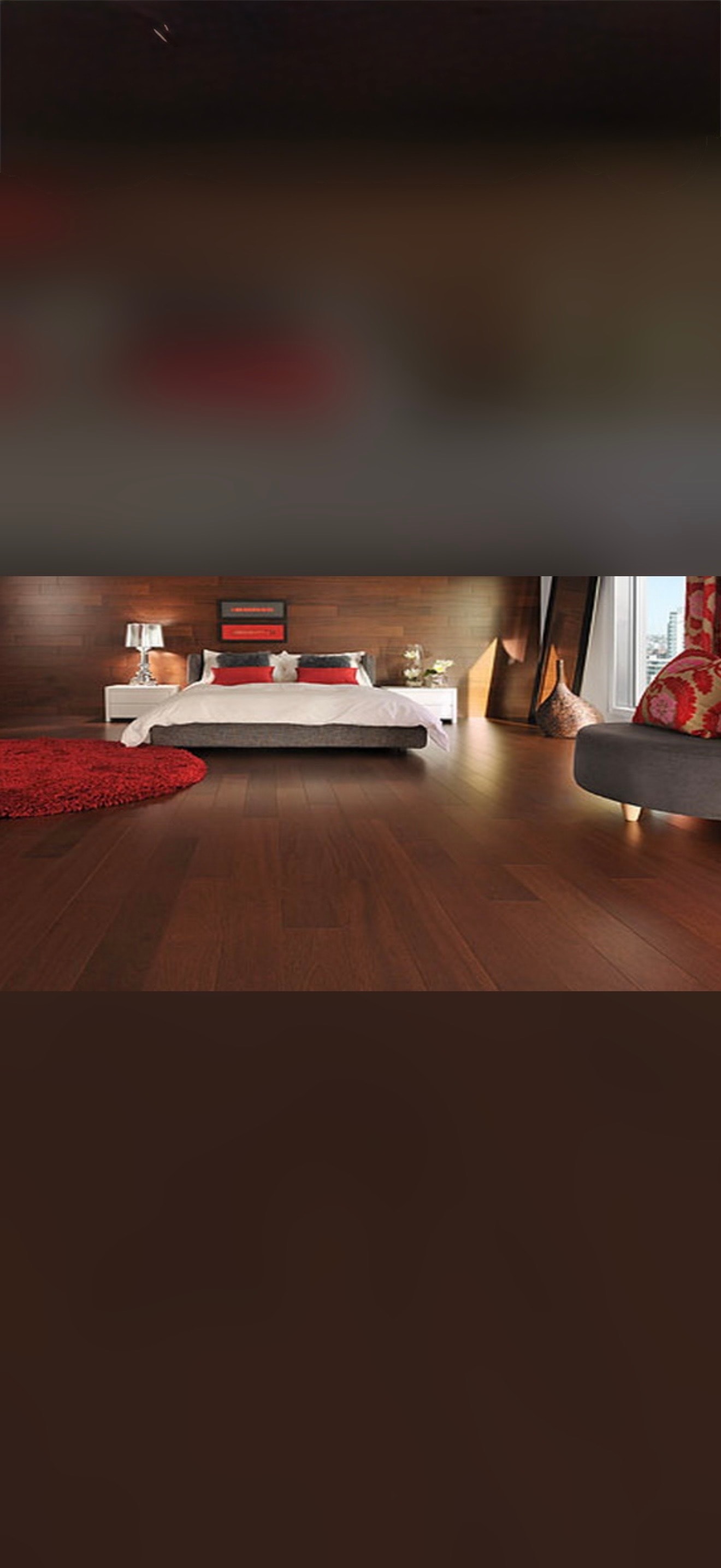 Modern bedroom with red accents and wood flooring